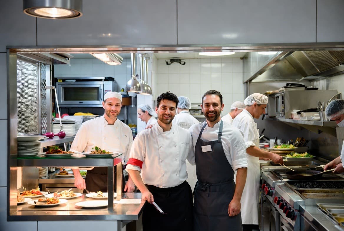 Kitchen team at the pass ready for service